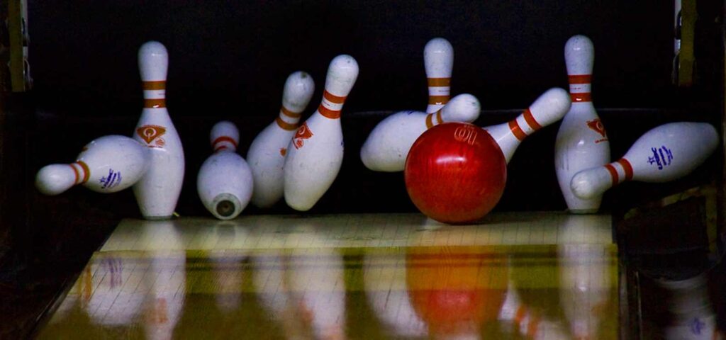 Bowling Ball, Bowling Shoes And Bowling Pins Side By Side by